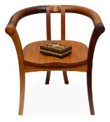 Senior Carmichael: a mixed wood bow armchair, made from timbers felled during the 1987 Hurricane