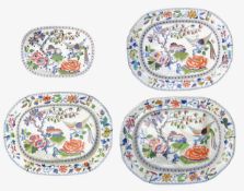 A graduated set of three Davenport Stone China meat dishes and a drainer