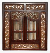 A carved hardwood mirror