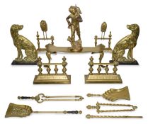A collection of brass fire andirons, dogs and tools