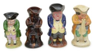 A group of four pottery Toby jugs