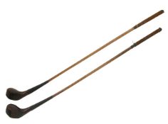 A pair of hickory shaft golf clubs