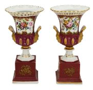 A pair of Paris porcelain twin handled campana urns