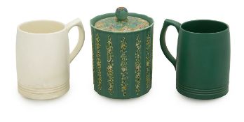 A pair of Wedgwood mugs and biscuit barrel