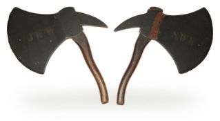 A pair of painted wood axes
