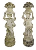 Garden Statuary: A pair of composite stone figures