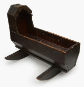 A folk art painted pine doll's crib