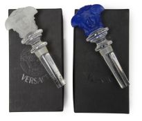 A pair of Versace Medusa wine bottle stoppers