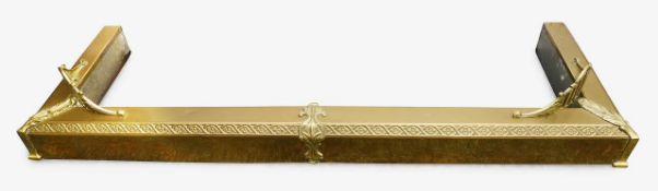 A brass fire fender
