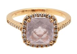 A kunzite and diamond dress ring