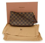 A boxed Louis Vuitton Damier Ebene pochette