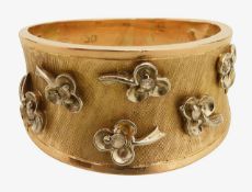 A tapered band ring with diamond set clovers