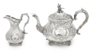 A Victorian silver teapot and cream jug