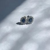 A pair of sapphire and diamond cluster ear rings
