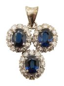 A diamond and sapphire cluster pendant