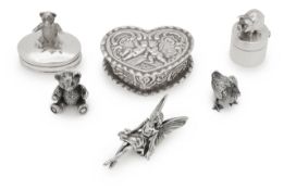 A collection of silver novelty boxes and figures