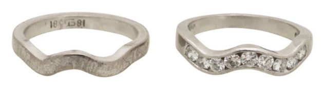 A platinum and diamond band ring with fitted band