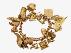 An gold charm bracelet with unusual adjustable charms