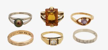 A diamond set band and five gem set rings