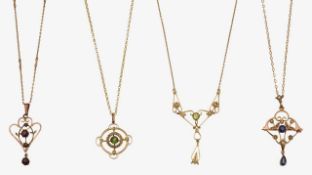 A collection of four Edwardian pendants