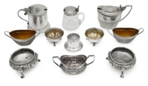 A collection of silver salts and mustard pots