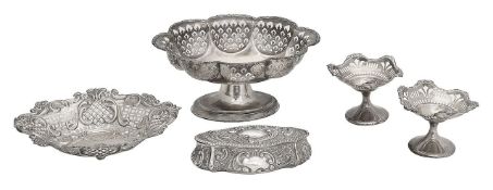 Three silver pedestal bowls, a bon-bon dish, and a dressing table box