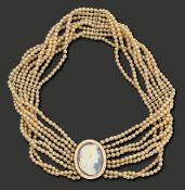 A cameo and simulated pearl choker necklace