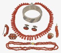 A collection of coral necklaces, brooches and accessories
