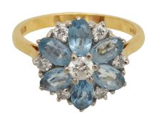 An 18ct diamond and blue topaz cluster ring