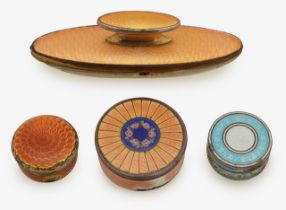 Three silver and guilloche enamel pill boxes and a nail buffer