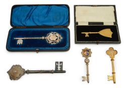 A group of silver and plated presentation keys