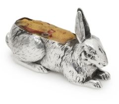 An Edward VII silver pin cushion, of a recumbent hare