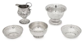 Four Edward VII and later silver bowls and a George III cream jug