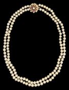 A two row pearl necklace with decorative clasp