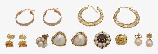 A pair of diamond and pearl heart ear studs with seven more