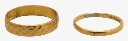 A 22ct textured wedding band and one more