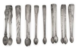 A group of eight George III to William IV silver tongs