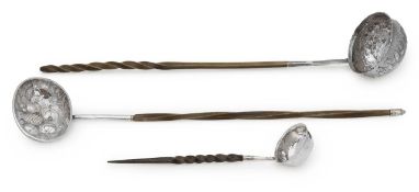 A group of three George III and later silver toddy ladles,