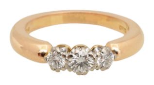 An 18ct rose gold diamond trilogy ring