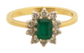 An 18ct emerald and diamond ring
