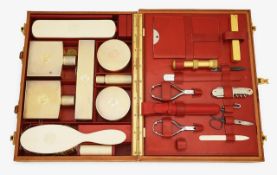 A French silver gilt travelling vanity set