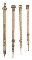A group of four 9ct gold propelling pencils