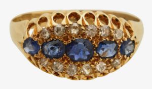 An Edwardian 18ct sapphire and diamond oval cluster ring