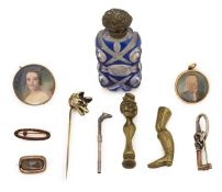 A collection of gold, silver and brass vertu