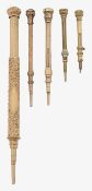 Four 9ct gold miniature propelling pencils and a rolled gold example