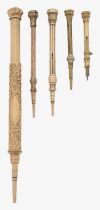 Four 9ct gold miniature propelling pencils and a rolled gold example