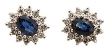A pair of 18ct diamond and sapphire cluster ear rings
