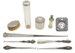 A group of silver mounted button hooks and dressing table items