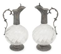 A pair of French silver mounted claret jugs