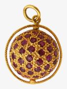 A 18ct ruby spinning orb pendant
